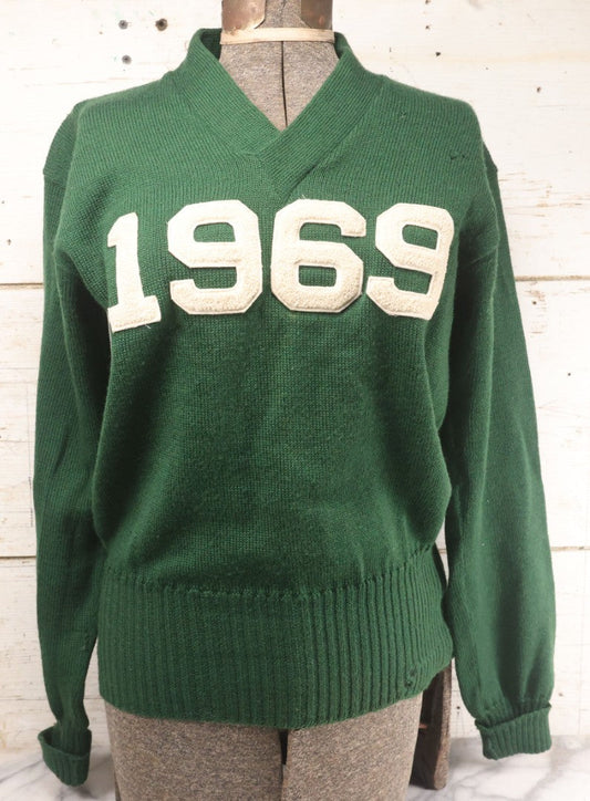 Lot 019 - Vintage Green Men's Knit 1969 College Sweater, Manufactured By Burean Holloway, Marked Size 42, Belonged To Ron Hillberry, With Hand-Stitched Name Tag