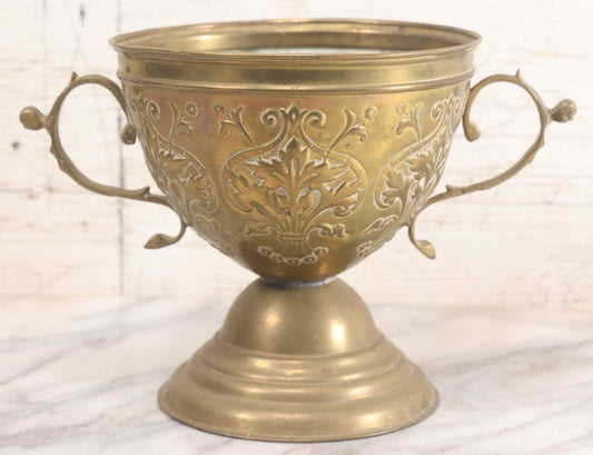 Lot 022 - Antique Pressed Brass Decorative Two-Handled Urn With Foliate Pattern Design And Weighted Base, 6-1/8" Height