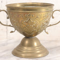 Lot 022 - Antique Pressed Brass Decorative Two-Handled Urn With Foliate Pattern Design And Weighted Base, 6-1/8" Height