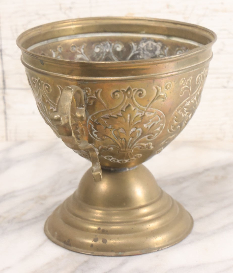 Lot 022 - Antique Pressed Brass Decorative Two-Handled Urn With Foliate Pattern Design And Weighted Base, 6-1/8" Height