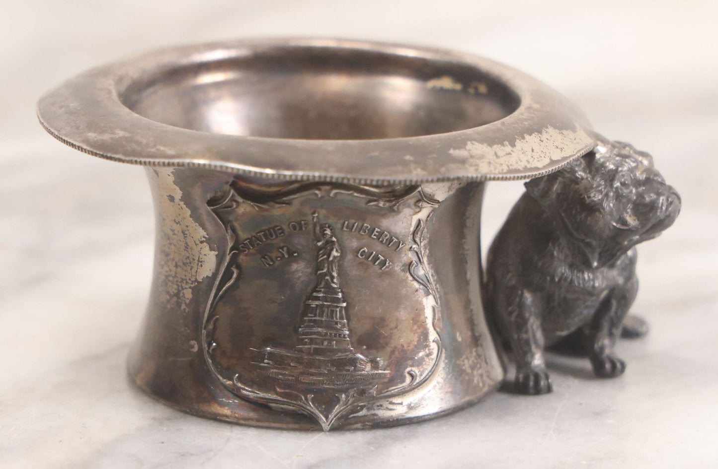 Lot 025 - Antique Souvenir Silverplate Metal Toothpick Holder With Bulldog Figure, Souvenir Of Statue Of Liberty, New York City, Manufactured By Kronheimer Oldenbusch & Co., 1-1/2" Height