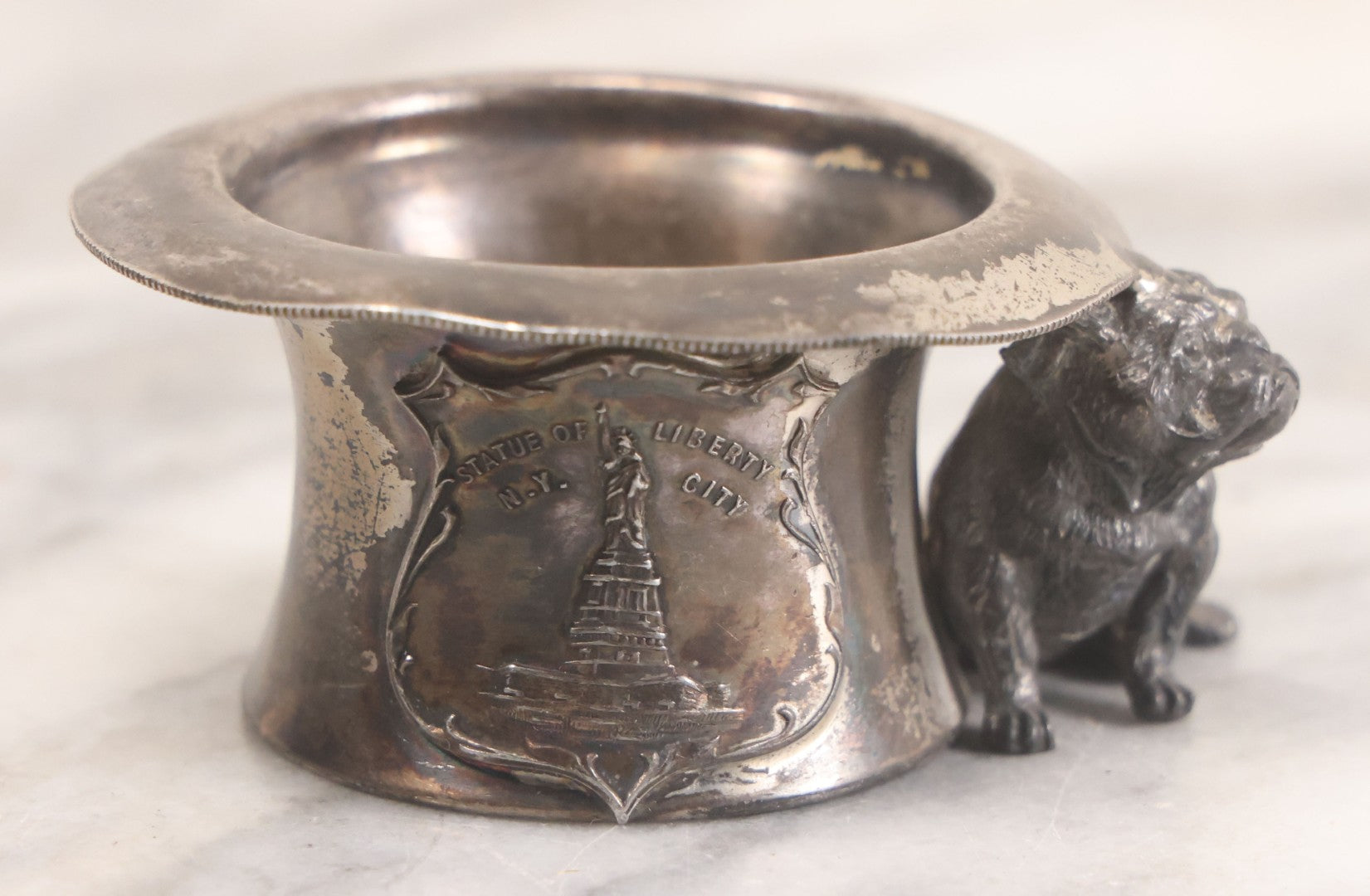 Lot 025 - Antique Souvenir Silverplate Metal Toothpick Holder With Bulldog Figure, Souvenir Of Statue Of Liberty, New York City, Manufactured By Kronheimer Oldenbusch & Co., 1-1/2" Height