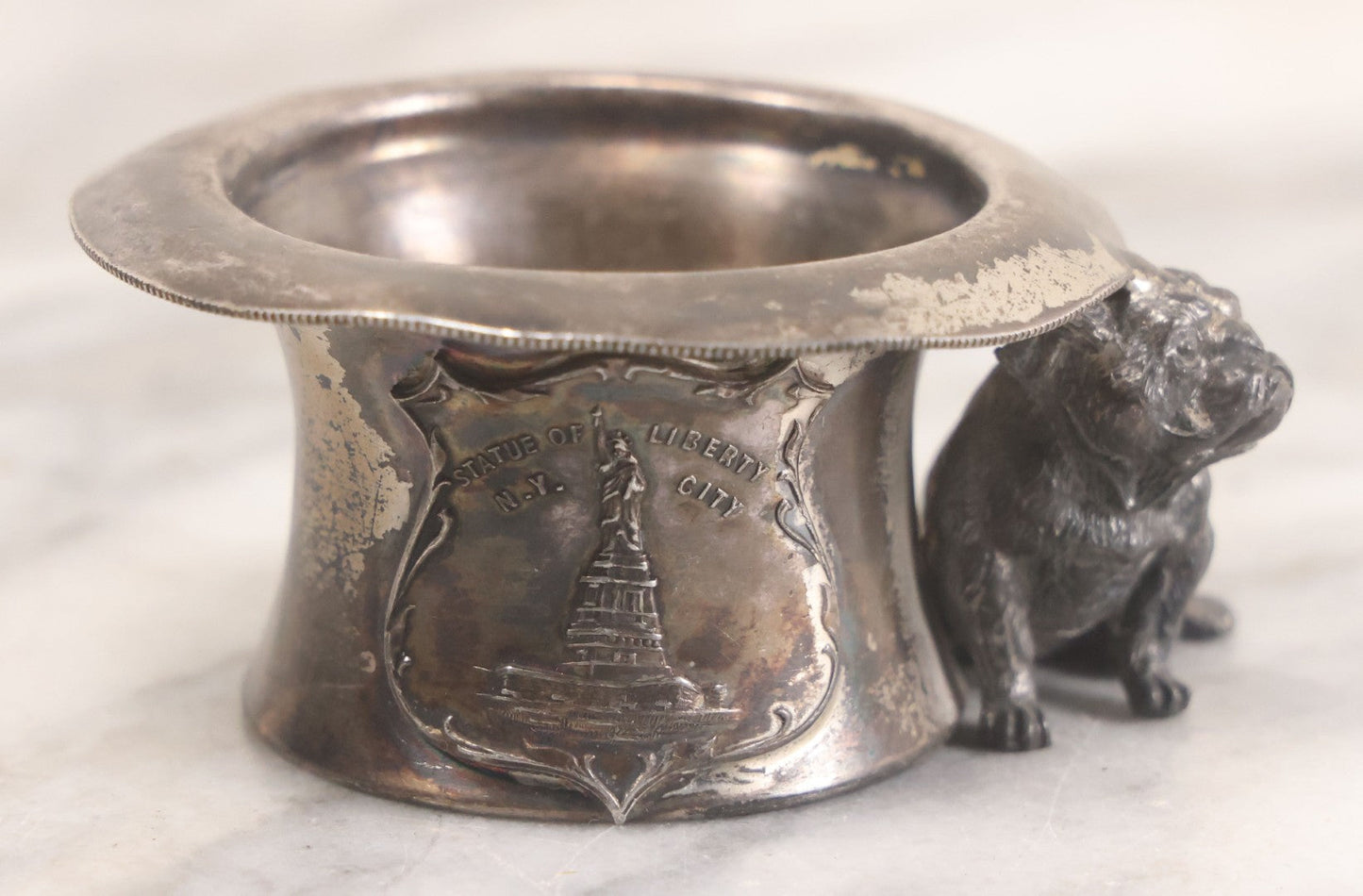 Lot 025 - Antique Souvenir Silverplate Metal Toothpick Holder With Bulldog Figure, Souvenir Of Statue Of Liberty, New York City, Manufactured By Kronheimer Oldenbusch & Co., 1-1/2" Height