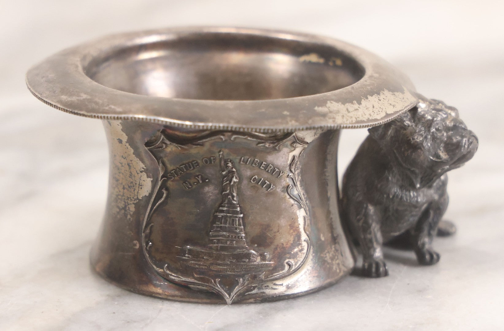 Lot 025 - Antique Souvenir Silverplate Metal Toothpick Holder With Bulldog Figure, Souvenir Of Statue Of Liberty, New York City, Manufactured By Kronheimer Oldenbusch & Co., 1-1/2" Height
