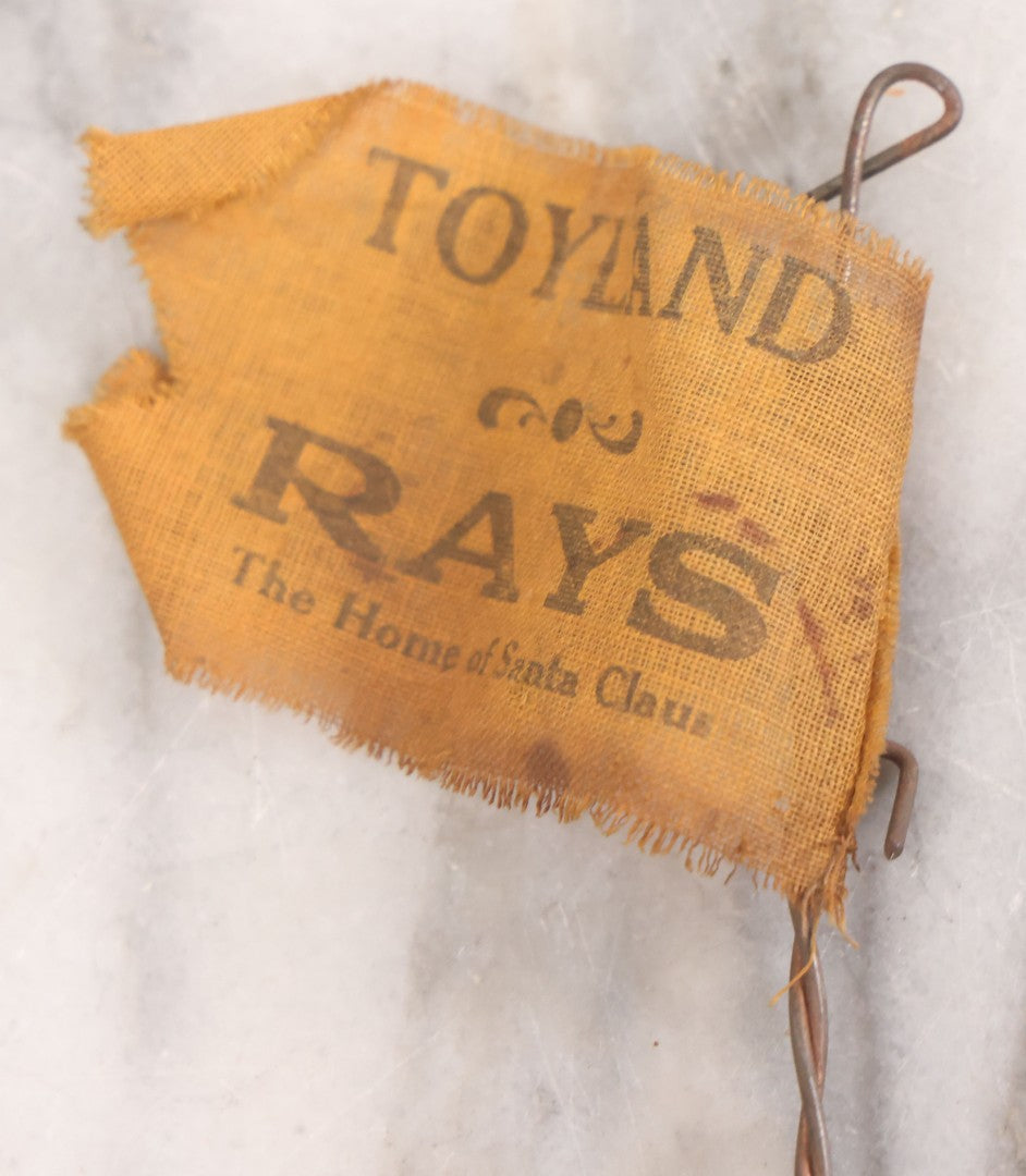 Lot 027 - Vintage Spinning Tin Fish Novelty Toy, Topped With Yellow Flag, "Toyland Rays: Home Of Santa Claus"