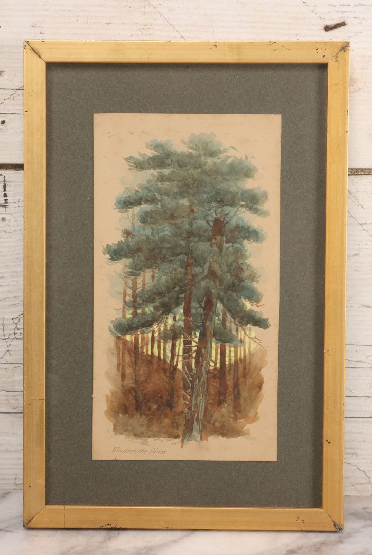Lot 032 - Antique Watercolor Landscape Painting Of Pine Trees, Woods, Titled "Under The Pines," Unsigned, In Original Frame, Framed By Wilbur Emery Window Shades And And Picture Framing, Meredith, New Hampshire, 7-7/8" x 11-7/8"