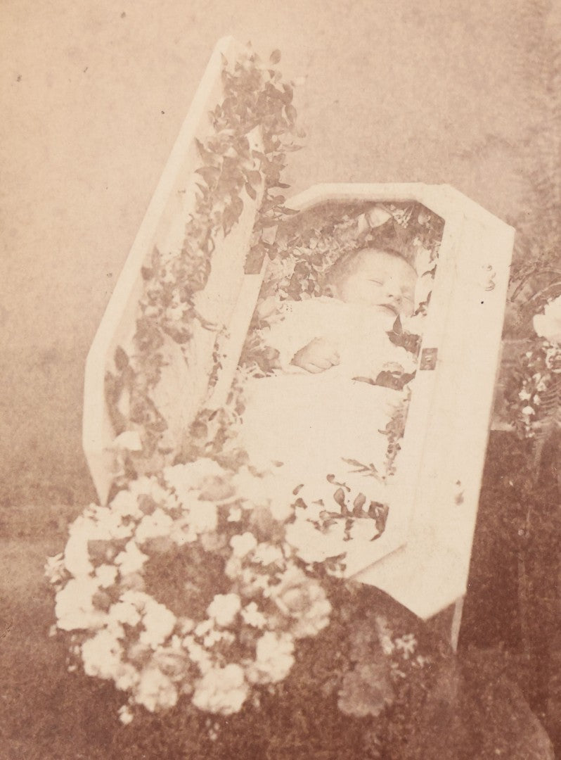 Lot 040 - Antique Victorian Post Mortem Cabinet Card Photograph Of A Deceased Infant In White Casket Surrounded By Flowers, Fitton, Photographer, Worcester, Massachusetts