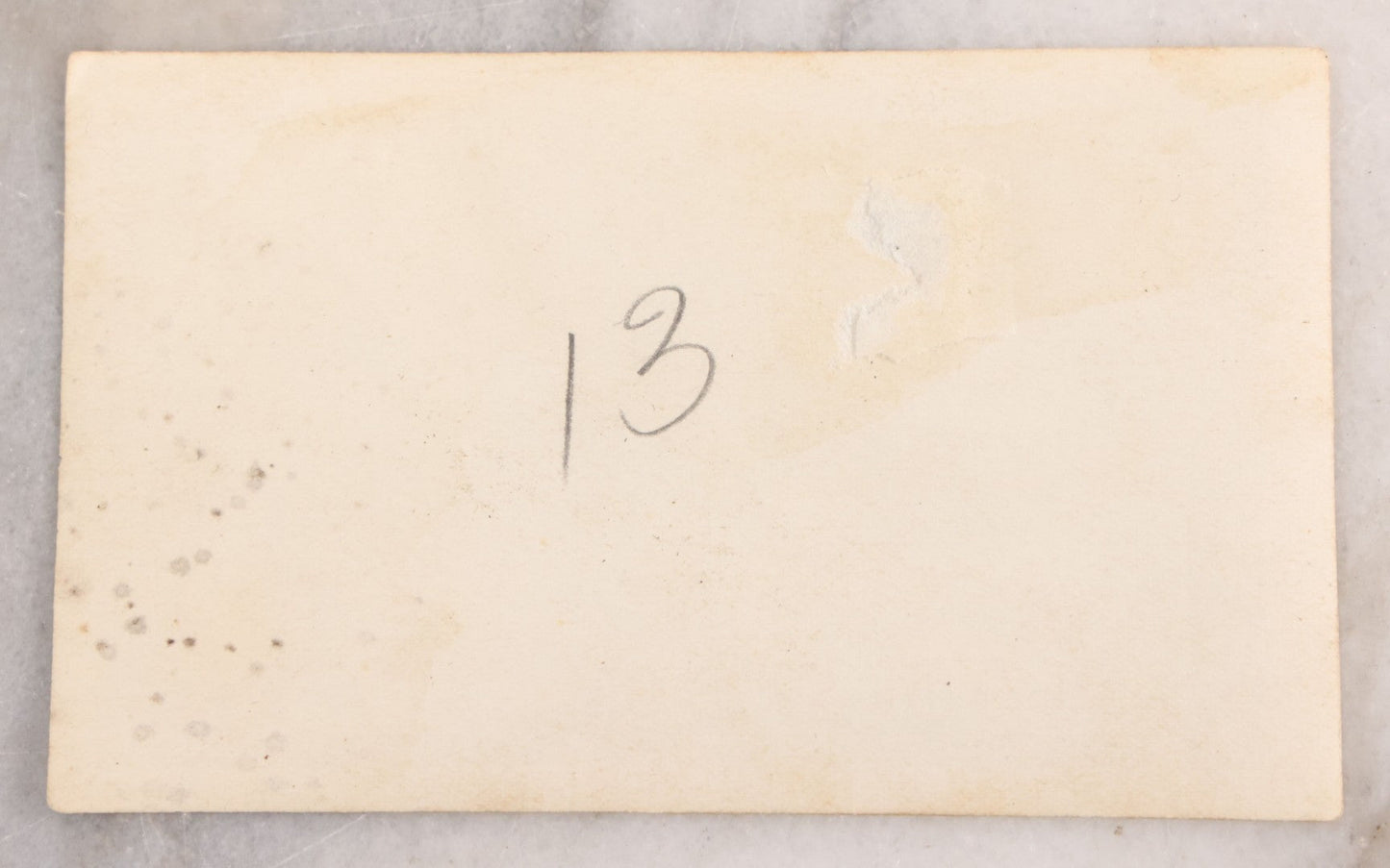 Lot 041 - Antique Post Mortem Snapshot Photograph Of A Deceased Infant In White Casket With Plaque And Flowers