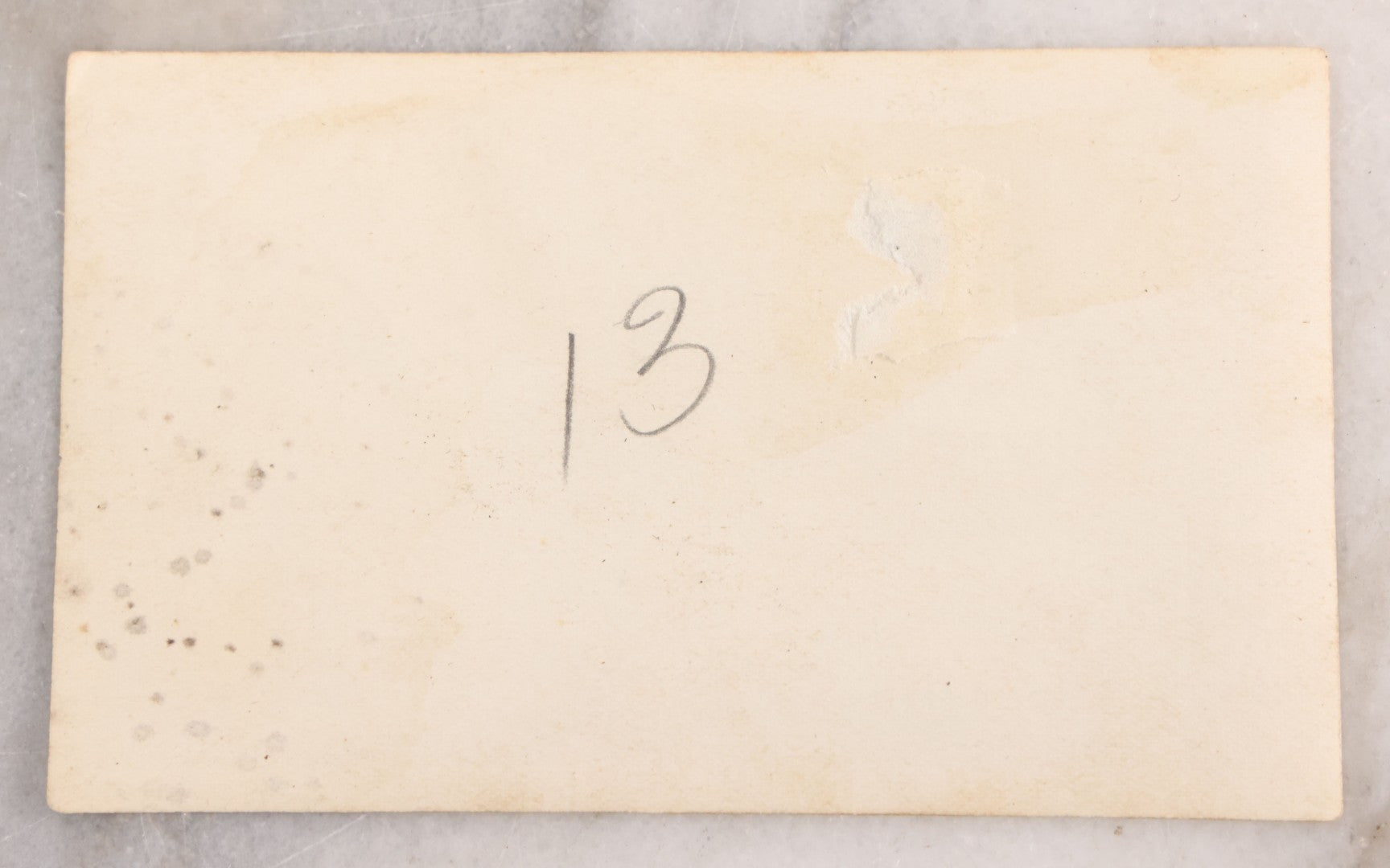 Lot 041 - Antique Post Mortem Snapshot Photograph Of A Deceased Infant In White Casket With Plaque And Flowers