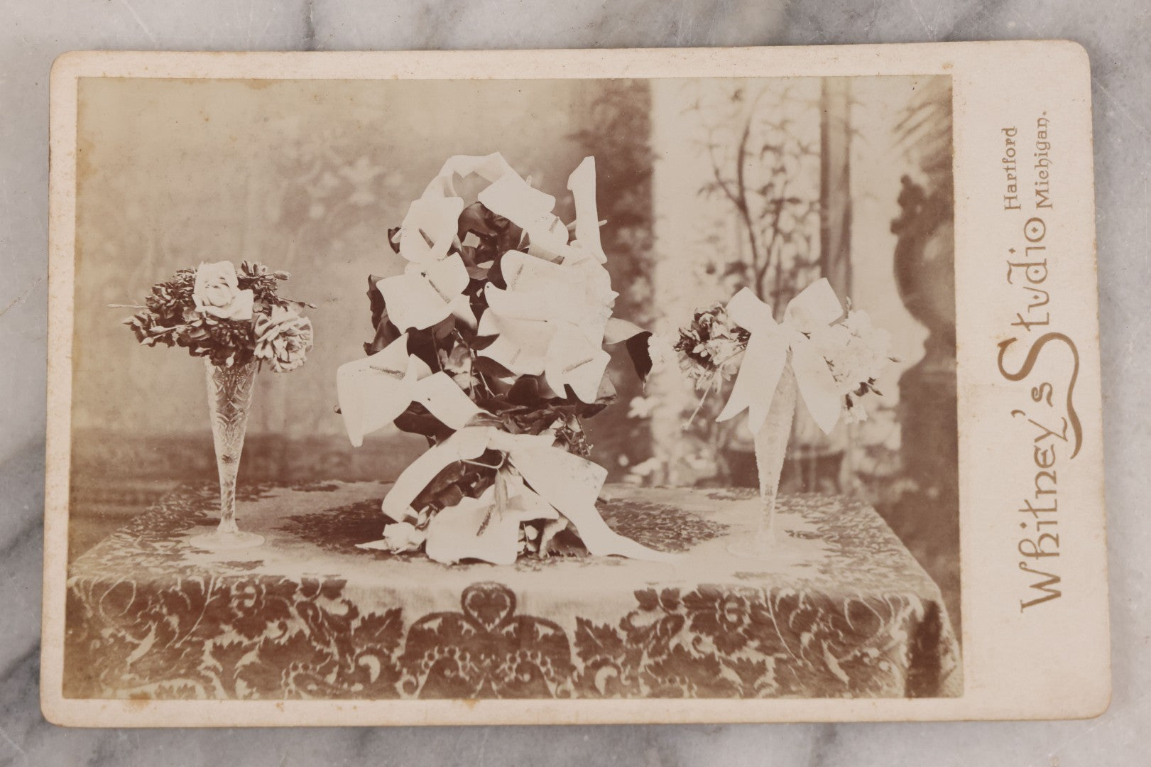 Lot 043 - Antique Cabinet Card Photograph Of Floral Arrangements, White Flowers With White Ribbon, Likely Bridal Or Funeral Flowers, Whitney's Studio, Photographers, Hartford, Michigan