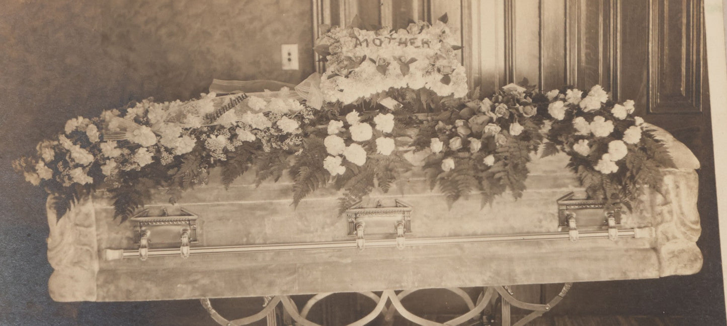 Lot 044 - Antique Boarded Funeral Photograph Of A Casket On Church Truck, Adorned With Flower Arrangements Including "Mother" Memorial