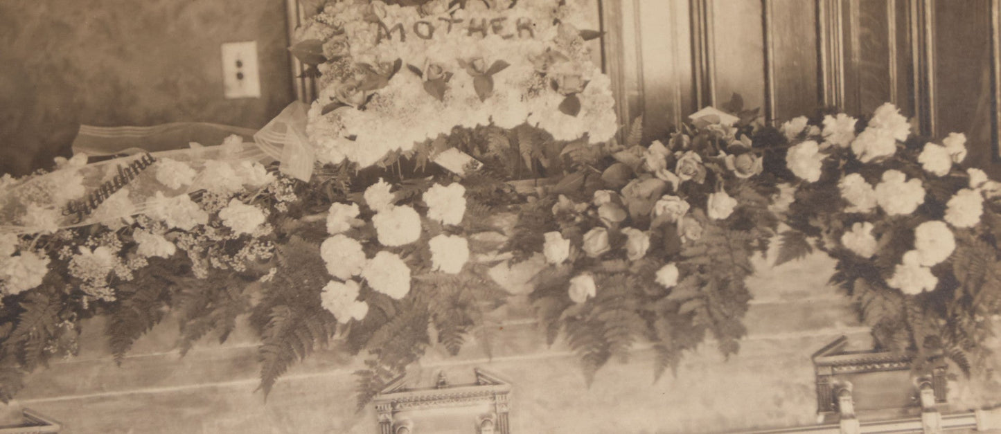 Lot 044 - Antique Boarded Funeral Photograph Of A Casket On Church Truck, Adorned With Flower Arrangements Including "Mother" Memorial