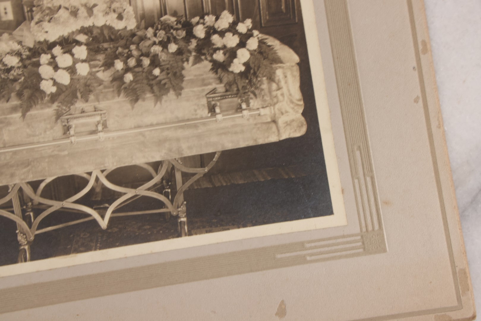 Lot 044 - Antique Boarded Funeral Photograph Of A Casket On Church Truck, Adorned With Flower Arrangements Including "Mother" Memorial