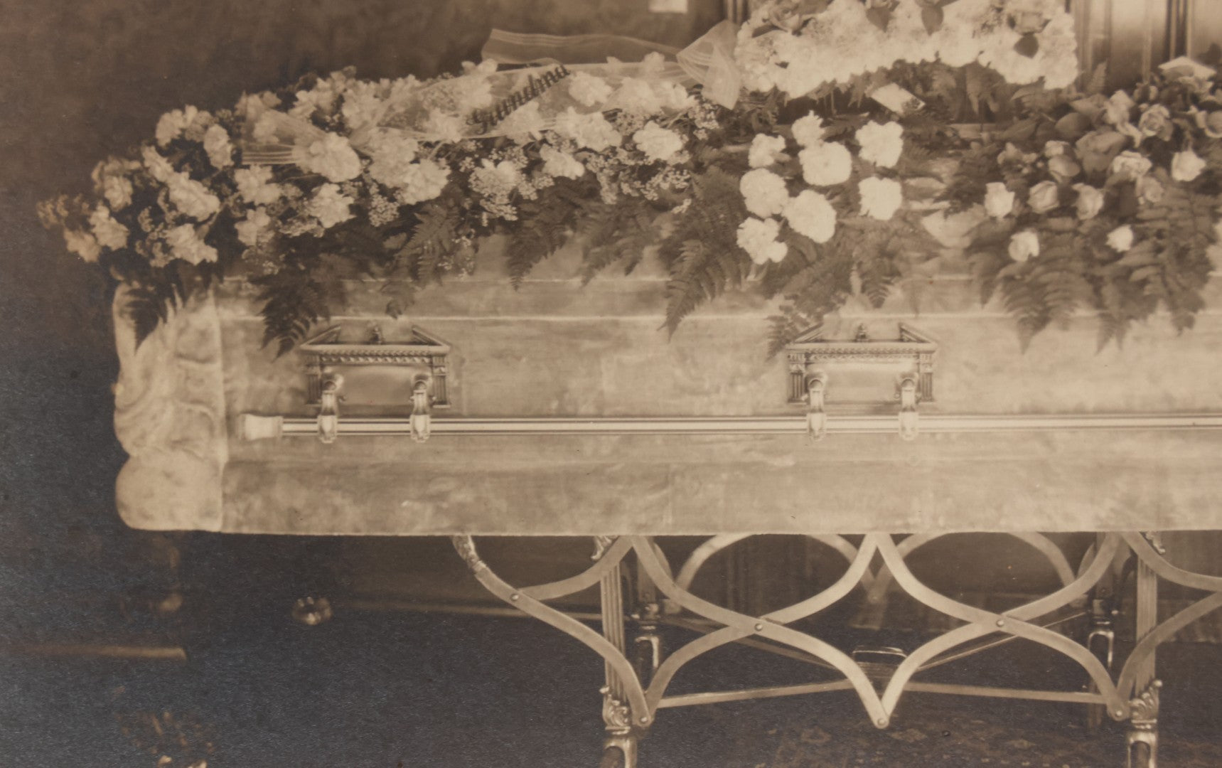 Lot 044 - Antique Boarded Funeral Photograph Of A Casket On Church Truck, Adorned With Flower Arrangements Including "Mother" Memorial