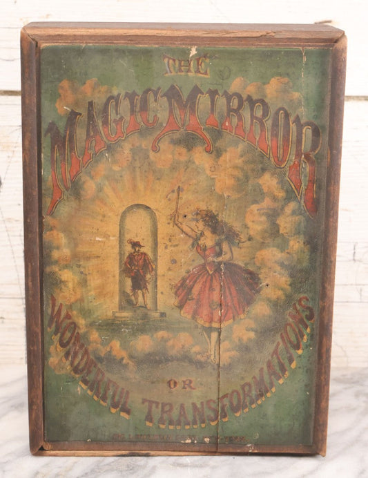 Lot 047 - Antique Lithographed Wooden Toy Box For "The Magic Mirror Or Wonderful Transformations" With Fairy Princess And Prince Characters, By Mcloughlin Bros., New York, Empty