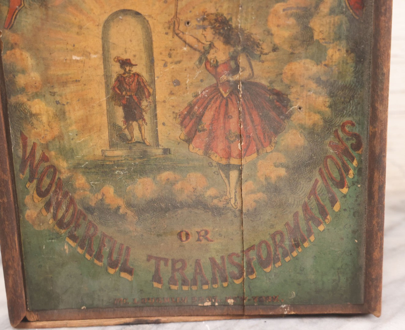 Lot 047 - Antique Lithographed Wooden Toy Box For "The Magic Mirror Or Wonderful Transformations" With Fairy Princess And Prince Characters, By Mcloughlin Bros., New York, Empty