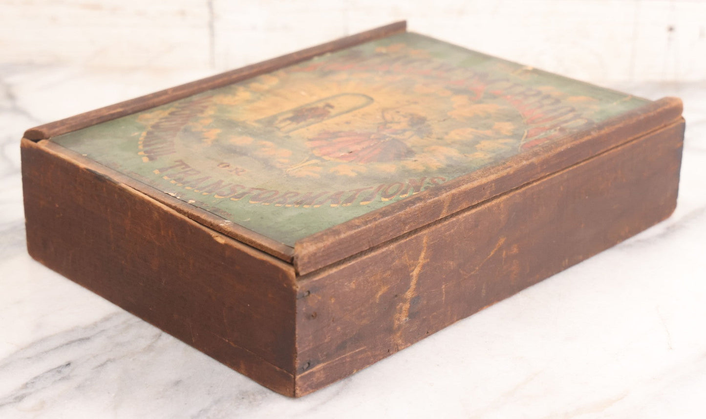 Lot 047 - Antique Lithographed Wooden Toy Box For "The Magic Mirror Or Wonderful Transformations" With Fairy Princess And Prince Characters, By Mcloughlin Bros., New York, Empty