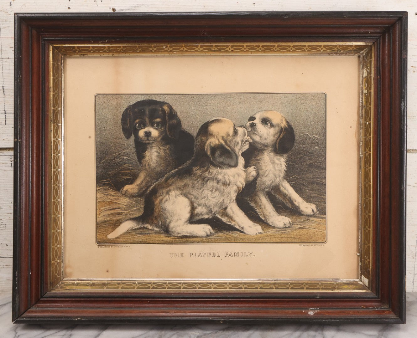 Lot 053 - Antique Hand Colored Lithograph Of Three Puppies, Titled "The Playful Family," Published By Currier And Ives, New York, In Deep Double Frame, 20-1/8" x 16-1/8"