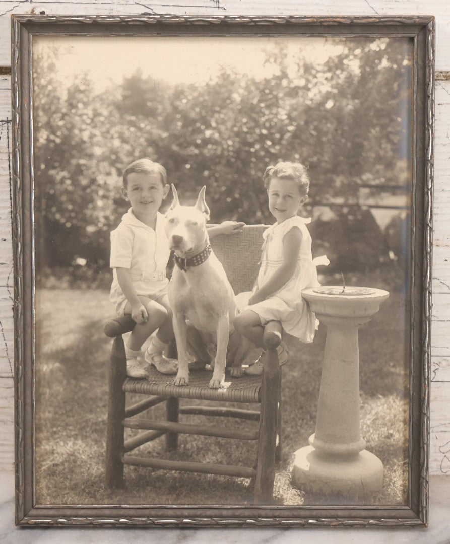 Lot 054 - Vintage Black And White Photograph Of Two Children Posing With Their English Bull Terrier Dog In Yard, In Frame, Framed By Donaldson's, Lowell, Massachusetts, 8-1/8" x 9-7/8"