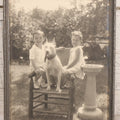 Lot 054 - Vintage Black And White Photograph Of Two Children Posing With Their English Bull Terrier Dog In Yard, In Frame, Framed By Donaldson's, Lowell, Massachusetts, 8-1/8" x 9-7/8"