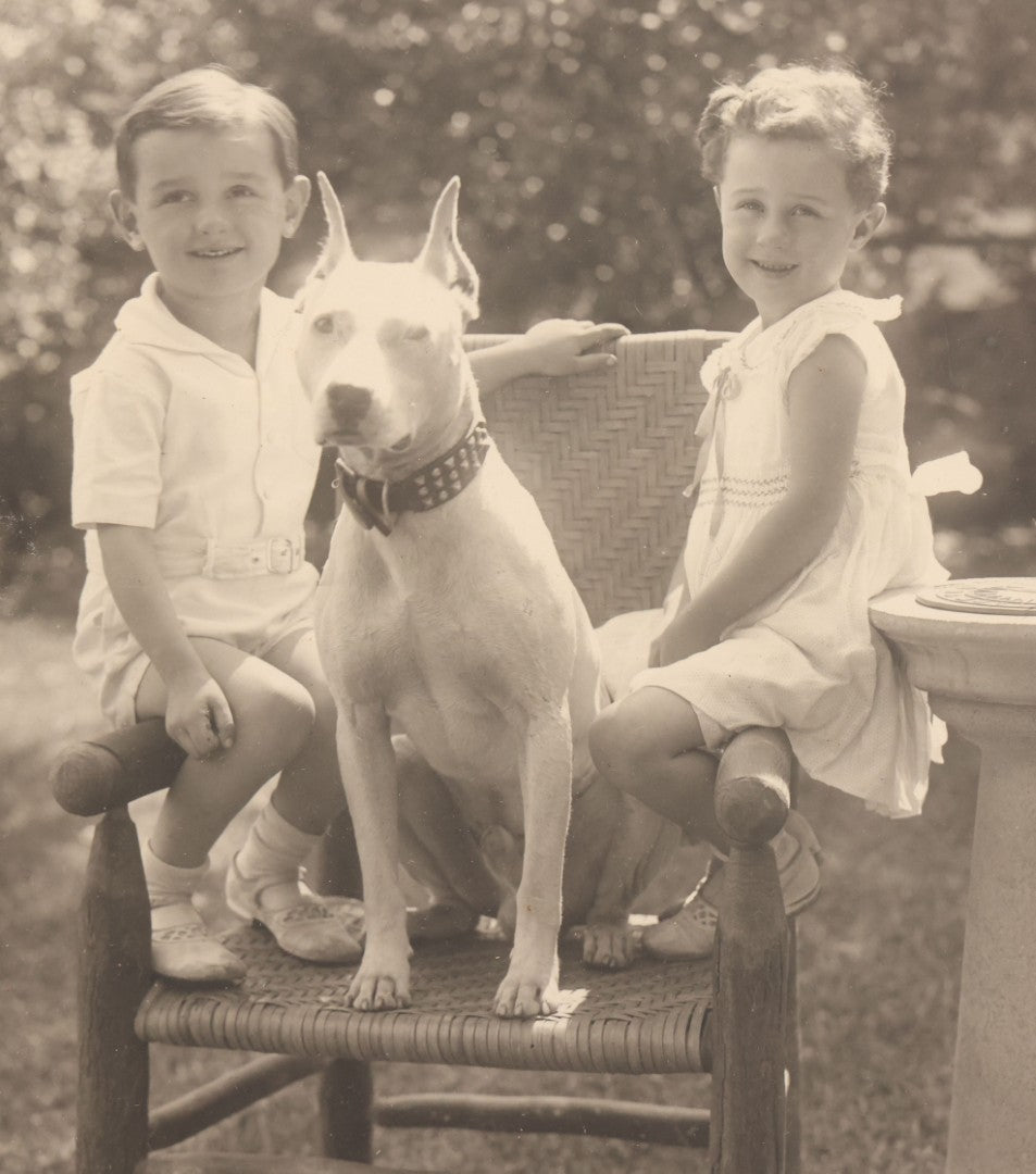 Lot 054 - Vintage Black And White Photograph Of Two Children Posing With Their English Bull Terrier Dog In Yard, In Frame, Framed By Donaldson's, Lowell, Massachusetts, 8-1/8" x 9-7/8"