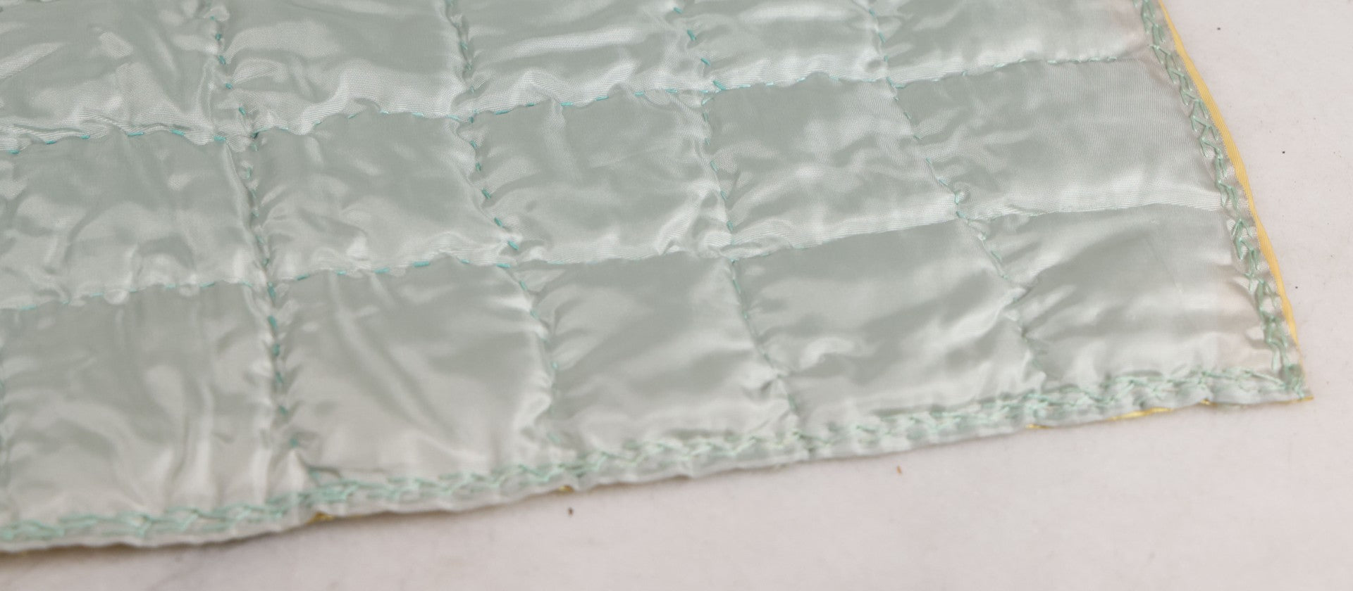 Lot 057 - Antique Hand Stitched Folk Art Quilt With White Kittens Climbing Cotton Plants, Robins Egg Blue Front And Yellow Reverse, Silk-Like Material, 39-1/2" x 42-1/2"