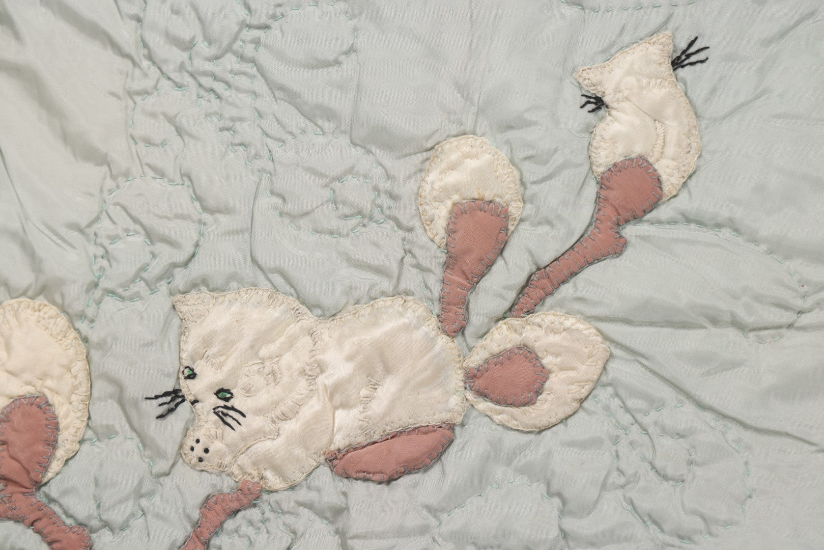 Lot 057 - Antique Hand Stitched Folk Art Quilt With White Kittens Climbing Cotton Plants, Robins Egg Blue Front And Yellow Reverse, Silk-Like Material, 39-1/2" x 42-1/2"