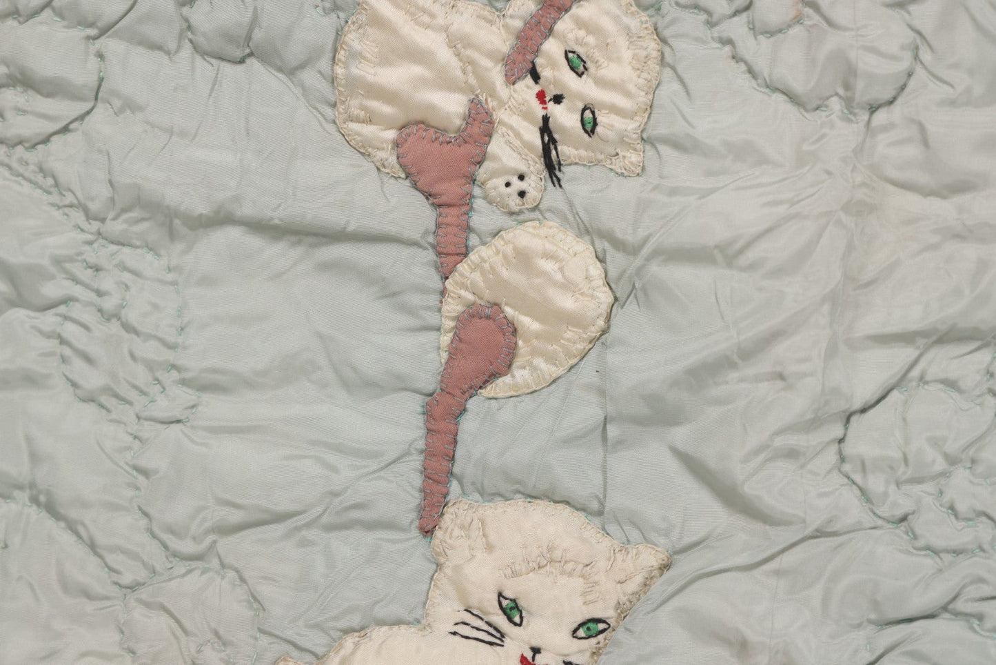 Lot 057 - Antique Hand Stitched Folk Art Quilt With White Kittens Climbing Cotton Plants, Robins Egg Blue Front And Yellow Reverse, Silk-Like Material, 39-1/2" x 42-1/2"