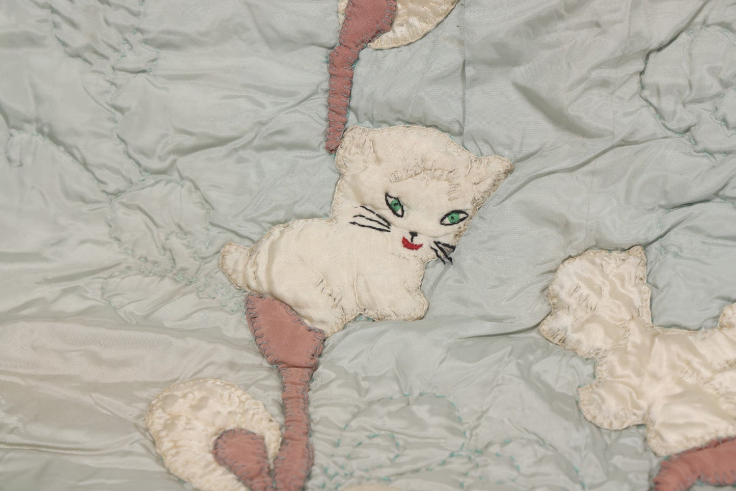 Lot 057 - Antique Hand Stitched Folk Art Quilt With White Kittens Climbing Cotton Plants, Robins Egg Blue Front And Yellow Reverse, Silk-Like Material, 39-1/2" x 42-1/2"