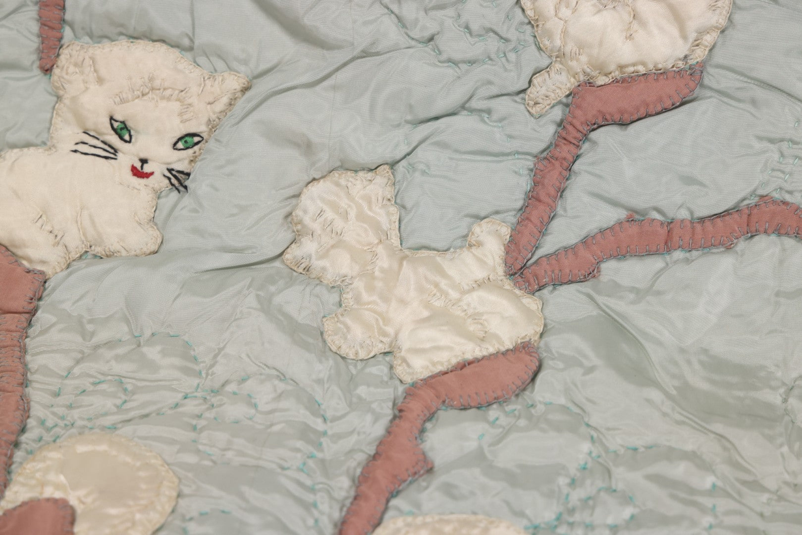 Lot 057 - Antique Hand Stitched Folk Art Quilt With White Kittens Climbing Cotton Plants, Robins Egg Blue Front And Yellow Reverse, Silk-Like Material, 39-1/2" x 42-1/2"