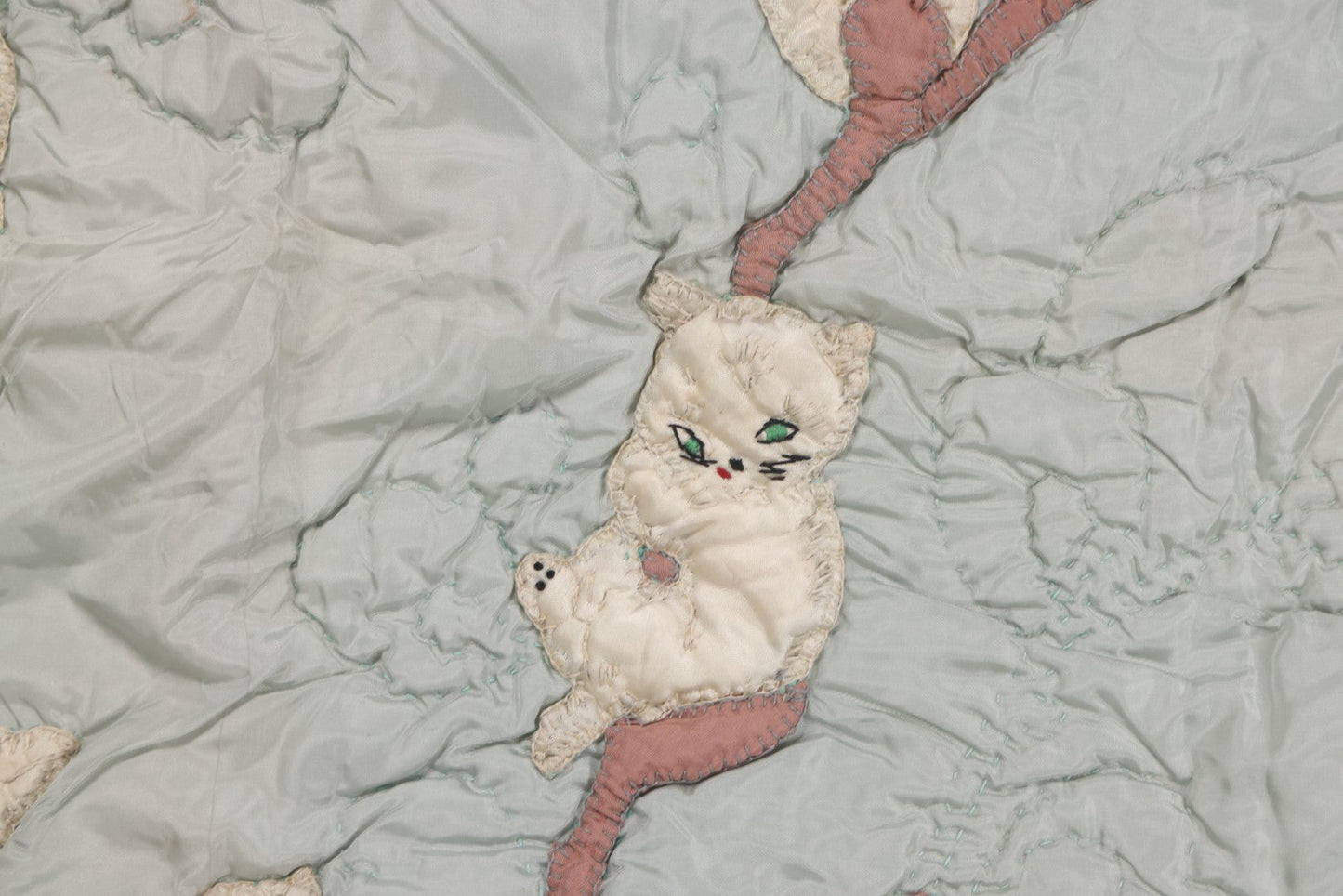 Lot 057 - Antique Hand Stitched Folk Art Quilt With White Kittens Climbing Cotton Plants, Robins Egg Blue Front And Yellow Reverse, Silk-Like Material, 39-1/2" x 42-1/2"