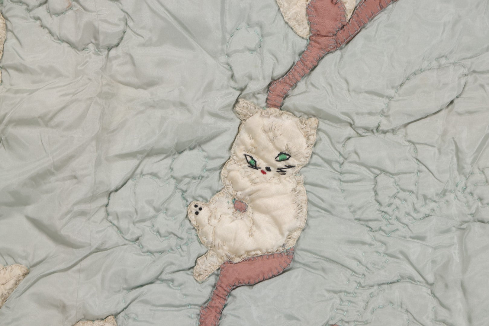 Lot 057 - Antique Hand Stitched Folk Art Quilt With White Kittens Climbing Cotton Plants, Robins Egg Blue Front And Yellow Reverse, Silk-Like Material, 39-1/2" x 42-1/2"