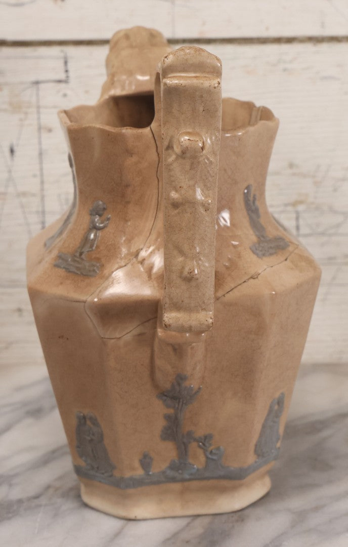 Lot 058 - Antique White Ironstone Pitcher With Figural Lion Head Spout, Blue Molded Neoclassical Figures, Note Damaged With Old Repairs, 9-3/4" Height