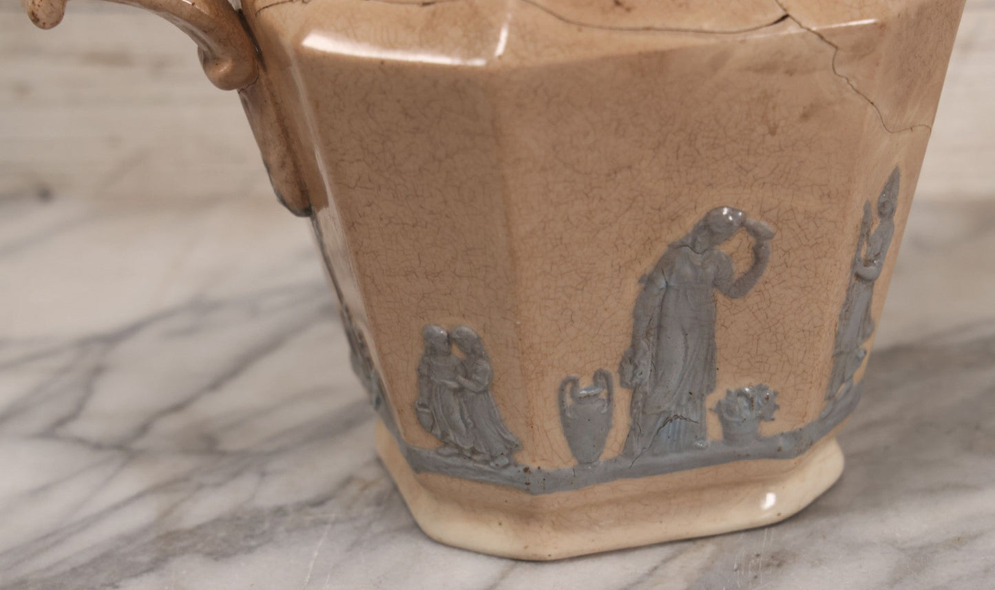 Lot 058 - Antique White Ironstone Pitcher With Figural Lion Head Spout, Blue Molded Neoclassical Figures, Note Damaged With Old Repairs, 9-3/4" Height