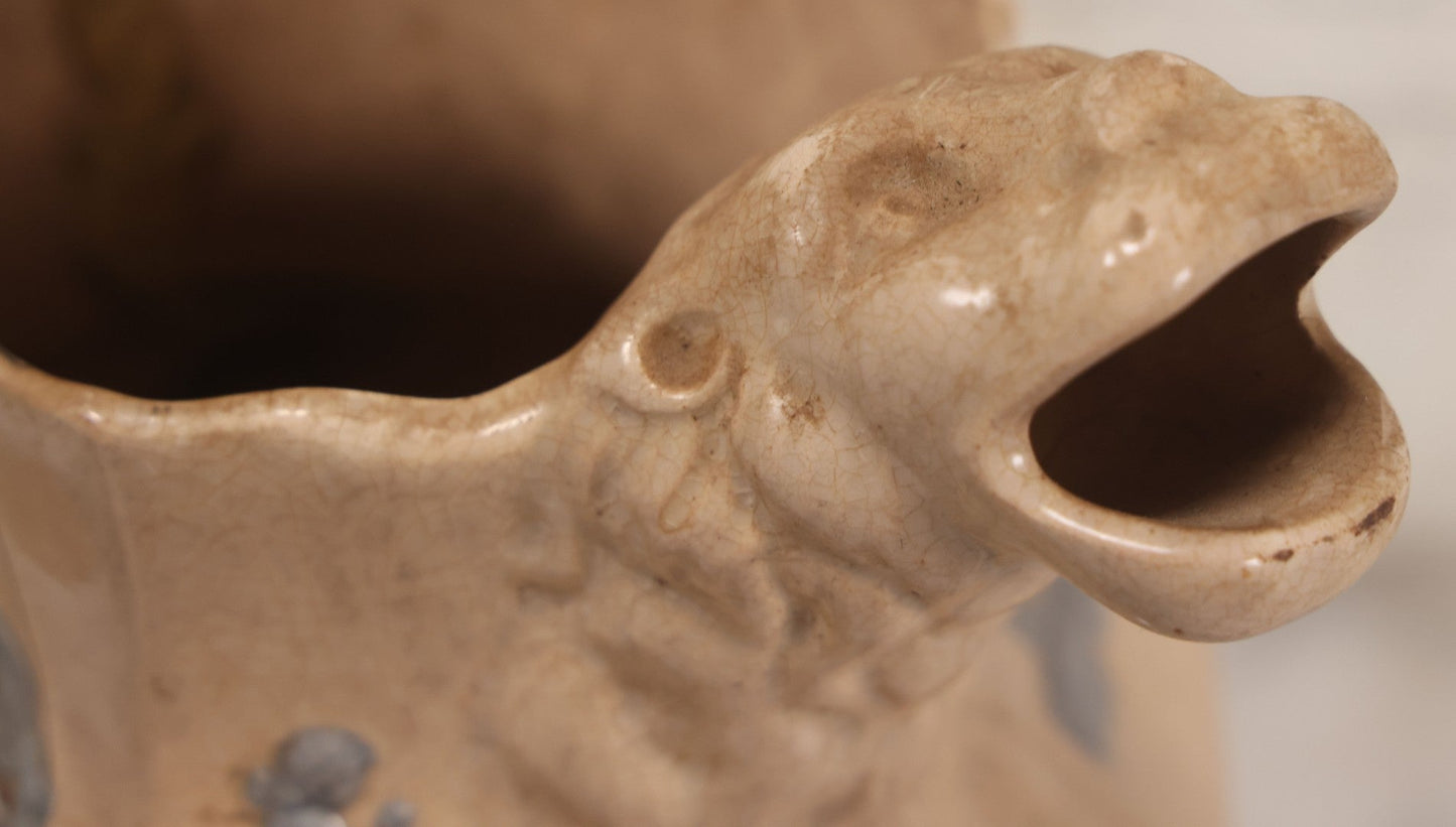 Lot 058 - Antique White Ironstone Pitcher With Figural Lion Head Spout, Blue Molded Neoclassical Figures, Note Damaged With Old Repairs, 9-3/4" Height