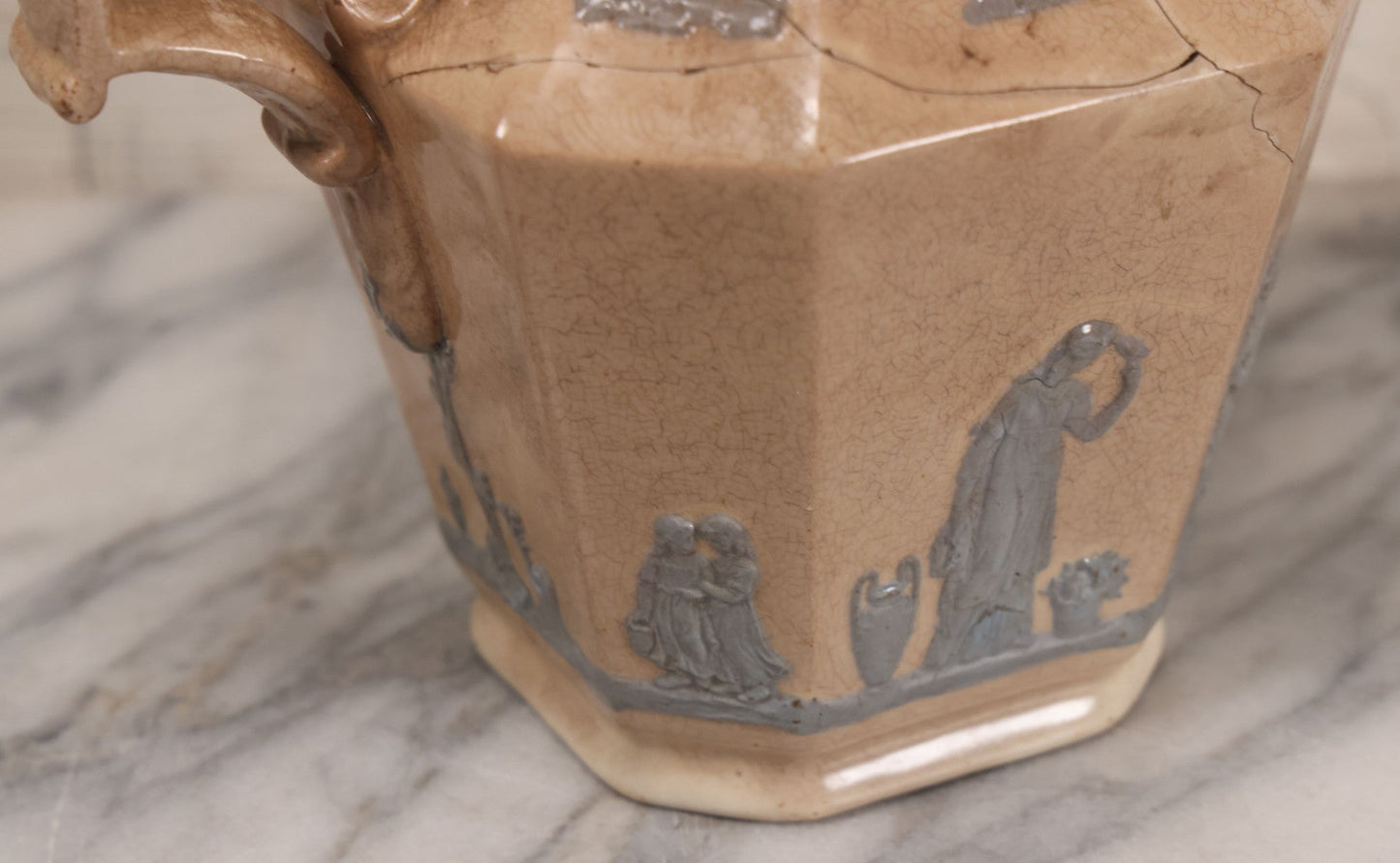 Lot 058 - Antique White Ironstone Pitcher With Figural Lion Head Spout, Blue Molded Neoclassical Figures, Note Damaged With Old Repairs, 9-3/4" Height