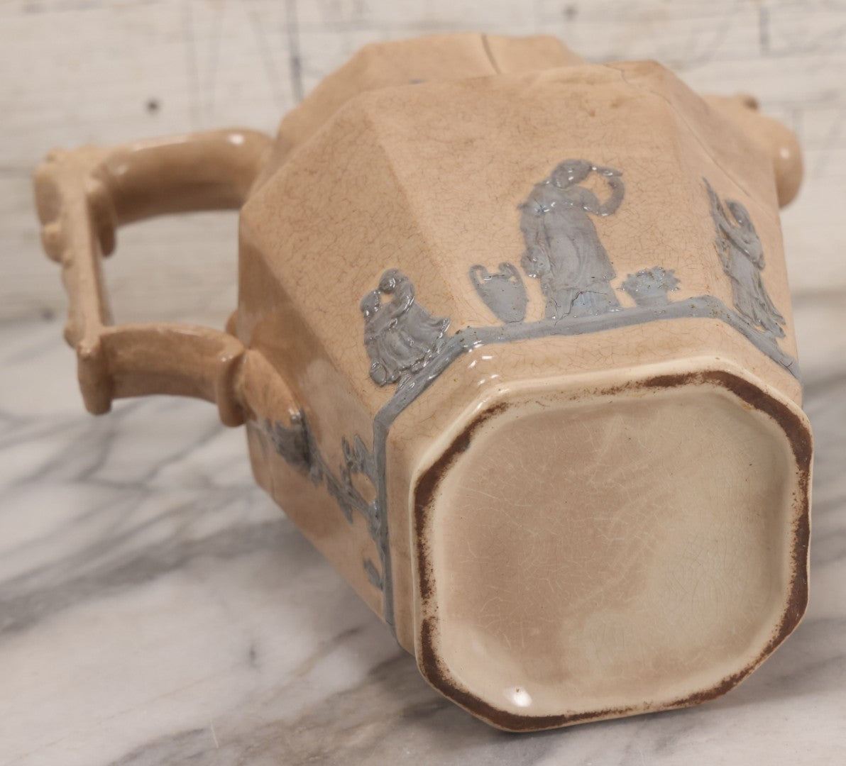 Lot 058 - Antique White Ironstone Pitcher With Figural Lion Head Spout, Blue Molded Neoclassical Figures, Note Damaged With Old Repairs, 9-3/4" Height