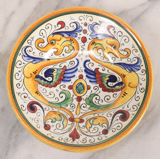 Lot 060 - Vintage Hand Painted Italian Deruta Majolica With Stylized Dolphins, Sea Monsters, Raffaellesco Design, Signed "S. Volpi, Deruta, II," 6-7/8" Diameter