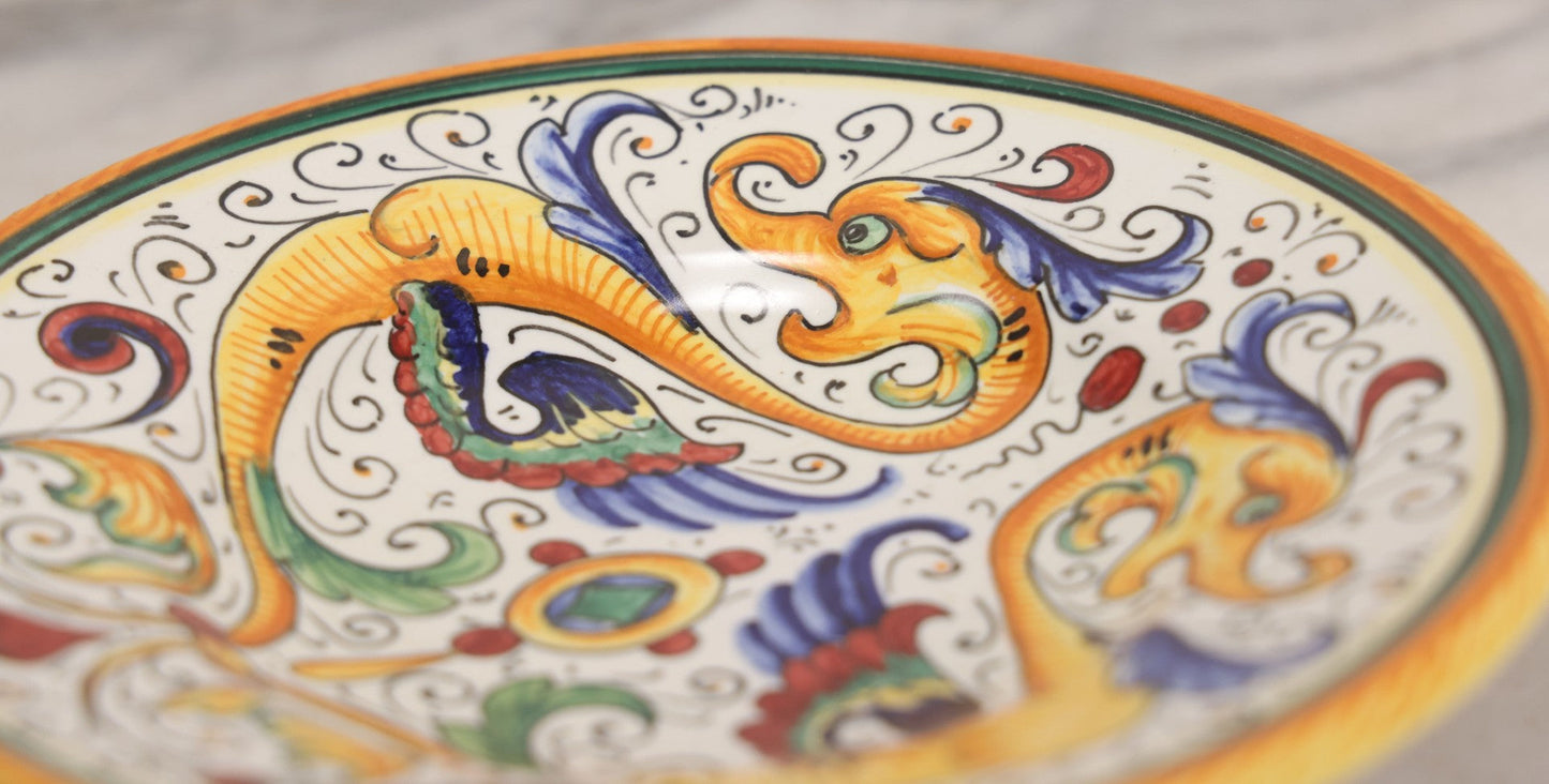 Lot 060 - Vintage Hand Painted Italian Deruta Majolica With Stylized Dolphins, Sea Monsters, Raffaellesco Design, Signed "S. Volpi, Deruta, II," 6-7/8" Diameter