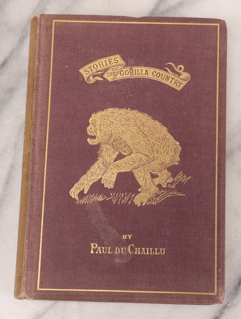 Lot 061 - "Stories Of The Gorilla Country, Narrated For Young People" Antique Book By Paul Du Chaillu, Illustrated, Gilded Gorilla Illustration On Cover, Harper & Brothers Publishers, New York, 1867