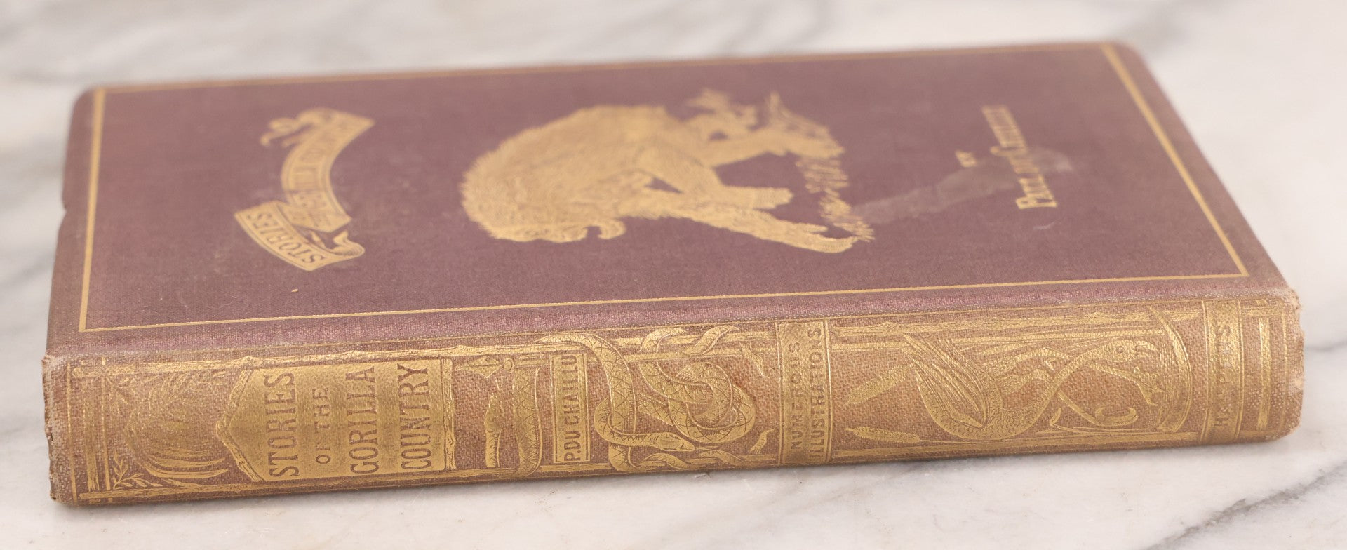 Lot 061 - "Stories Of The Gorilla Country, Narrated For Young People" Antique Book By Paul Du Chaillu, Illustrated, Gilded Gorilla Illustration On Cover, Harper & Brothers Publishers, New York, 1867