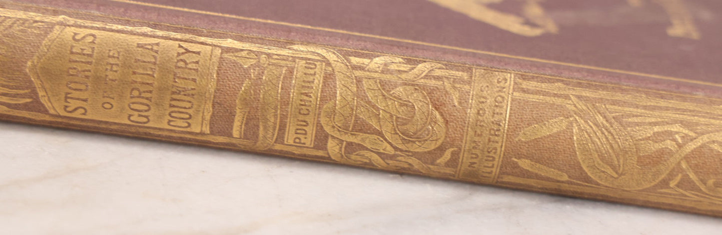 Lot 061 - "Stories Of The Gorilla Country, Narrated For Young People" Antique Book By Paul Du Chaillu, Illustrated, Gilded Gorilla Illustration On Cover, Harper & Brothers Publishers, New York, 1867