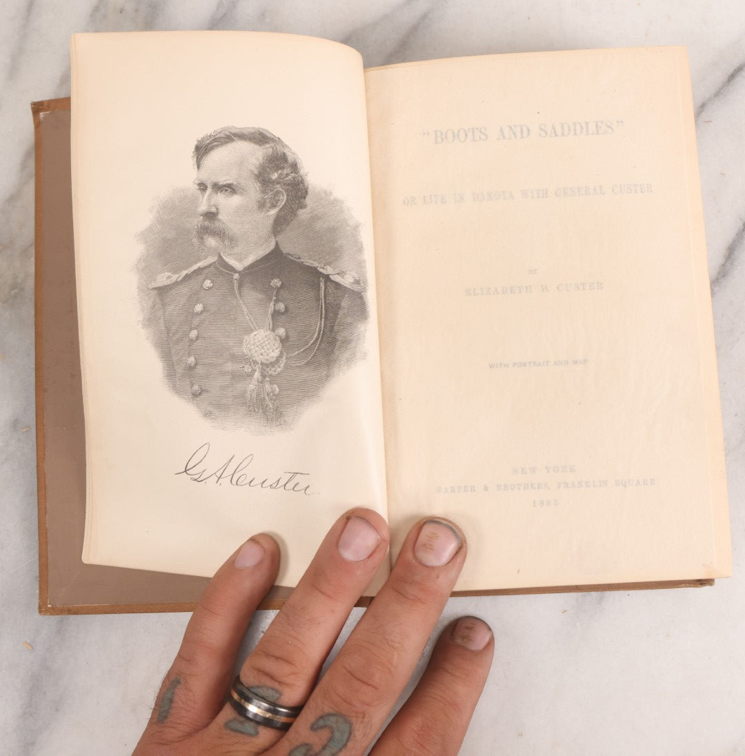 Lot 068 - "Boots And Saddles, Or Life In Dakota With General Custer" Antique Book By Elizabeth B. Custer, Widow Of General George Armstrong Custer, With Portrait And Map, Harper & Brothers, Publishers, New York, 1885