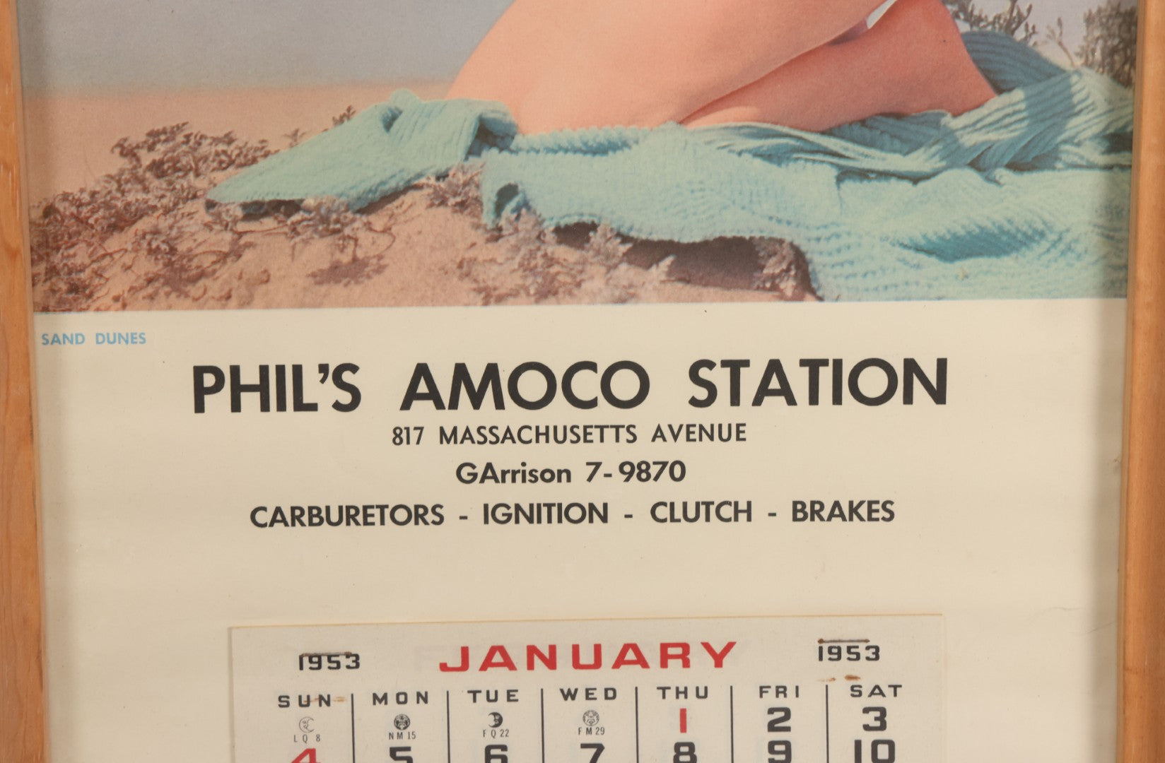 Lot 076 - Vintage Nude Woman Photo Pin-Up 1953 Calendar, "Sand Dunes," Advertisement For Phil's Amoco Station, Cambridge, Massachusetts, In Frame, 11-3/4" x 21-3/8"