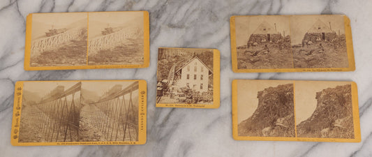 Lot 084 - Grouping Of Four (And A Half) Antique Stereoview Stereocards With Photos Of Landmarks In The White Mountains, New Hampshire, Including The Old Man Of The Mountain, Tip Top House & Jacob's Ladder, Mt. Washington, And Frankenstein & Trestle Train
