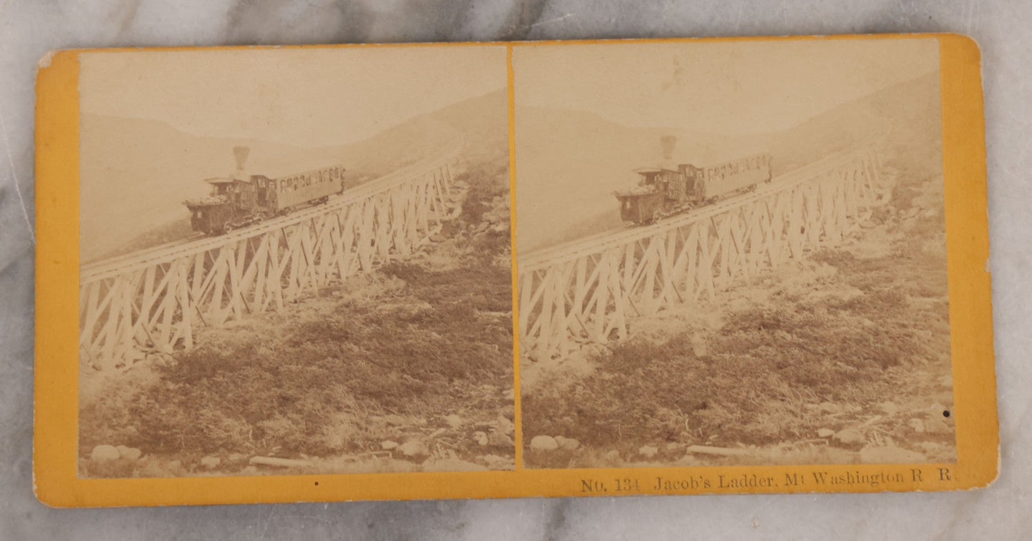 Lot 084 - Grouping Of Four (And A Half) Antique Stereoview Stereocards With Photos Of Landmarks In The White Mountains, New Hampshire, Including The Old Man Of The Mountain, Tip Top House & Jacob's Ladder, Mt. Washington, And Frankenstein & Trestle Train