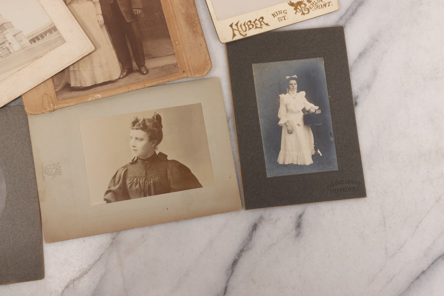 Lot 089 - Grouping Of 15 Antique Photographs Including Many Cabinet Card Portraits, Wedding Photo, Group Of Girls, Building, Tree, And More