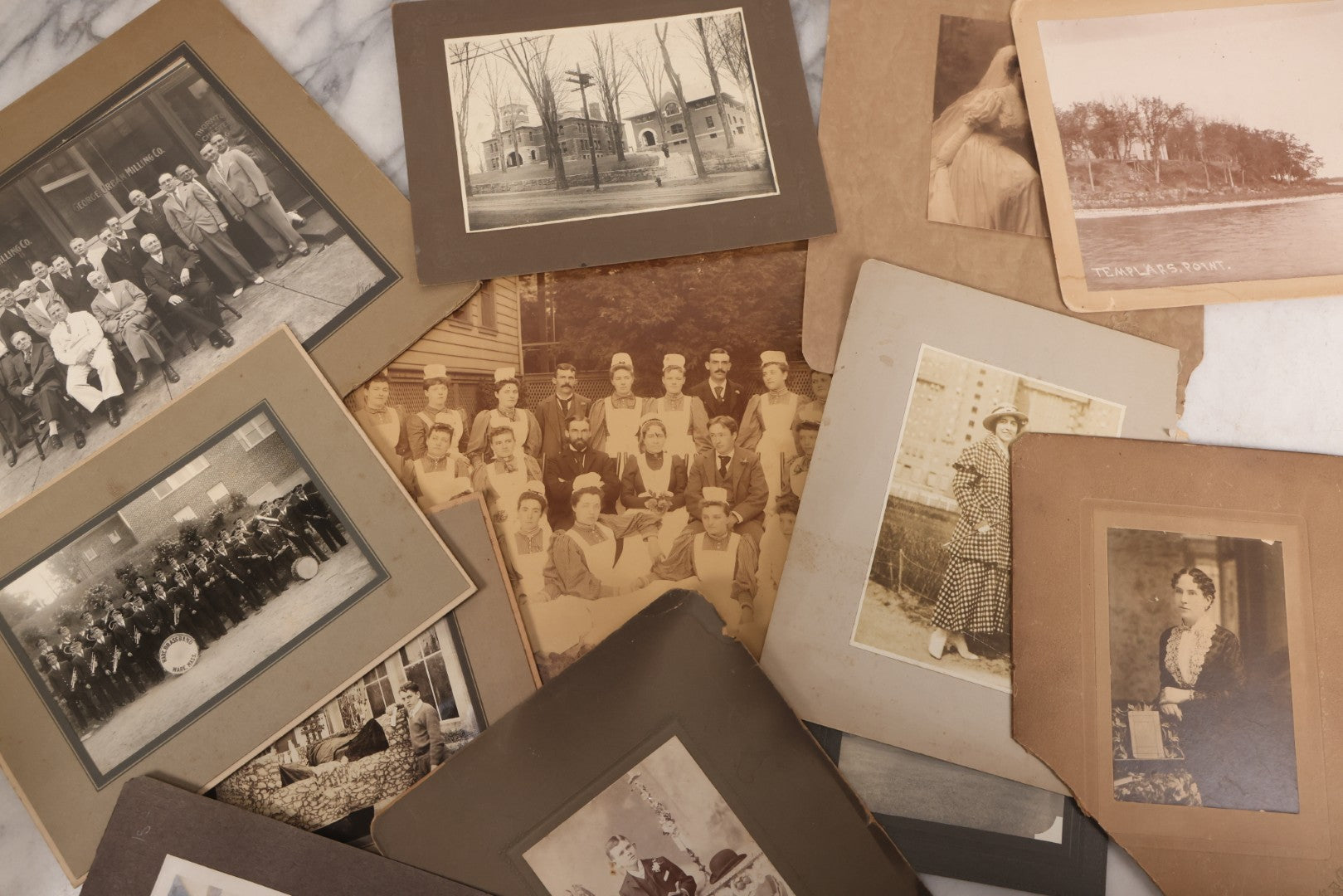 Lot 090 - Grouping Of 12 Antique Photographs Including Housekeeping Staff, Executives Of George Urban Milling Co., Templars Point, Leech Lake, Minnesota, Monson Academy, Monson, Mass, Ware Brass Band, Parade Float, & More