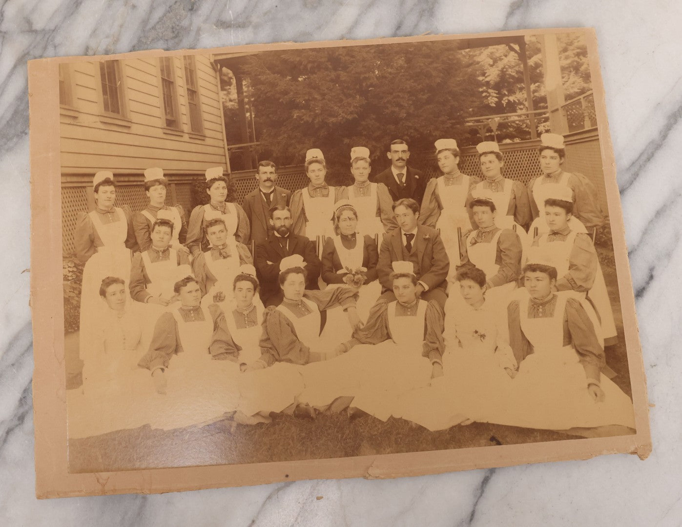 Lot 090 - Grouping Of 12 Antique Photographs Including Housekeeping Staff, Executives Of George Urban Milling Co., Templars Point, Leech Lake, Minnesota, Monson Academy, Monson, Mass, Ware Brass Band, Parade Float, & More