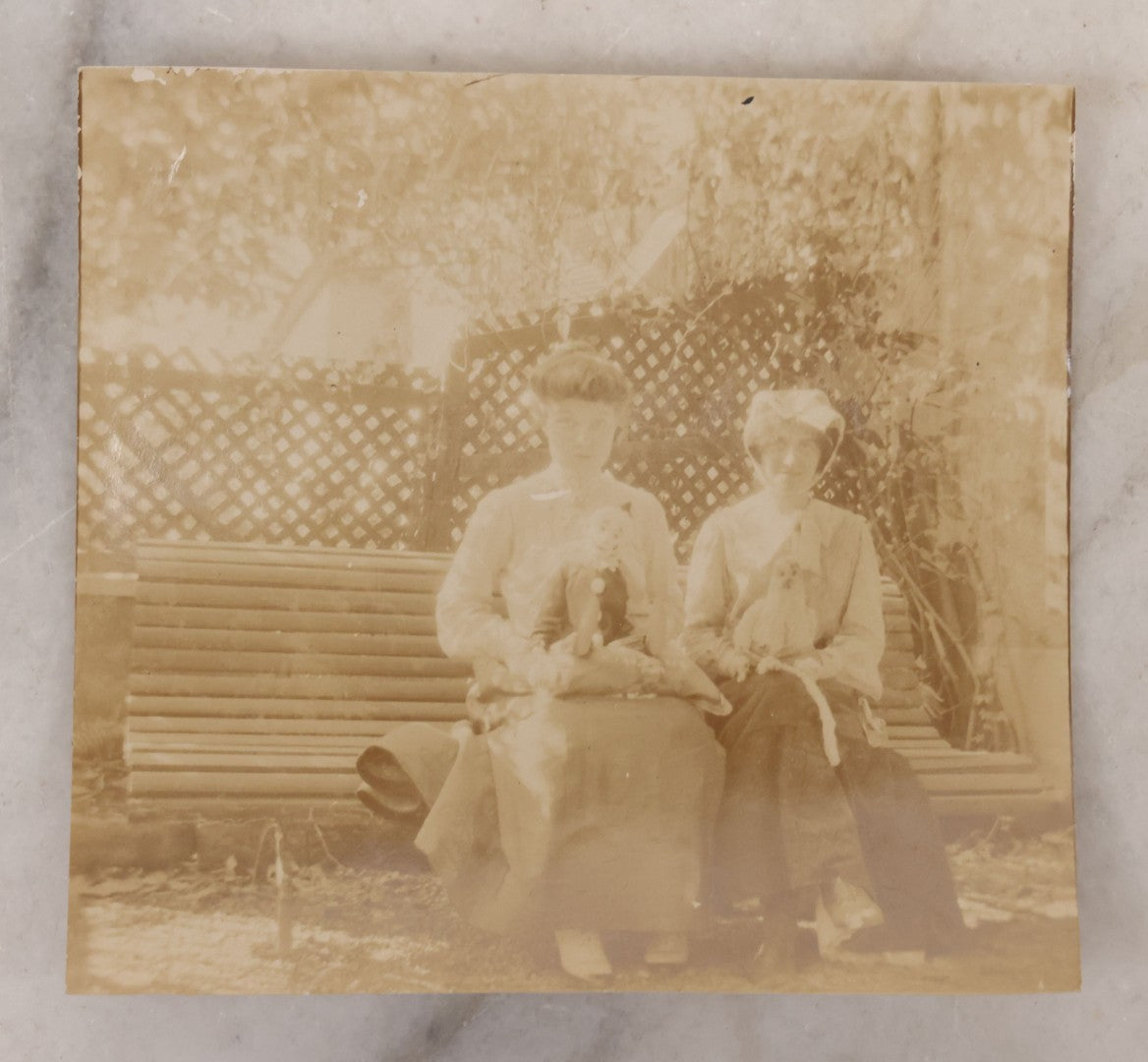 Lot 095 - Single Antique Snapshot Photograph Of Two Young Women Posing With Clown Dolls